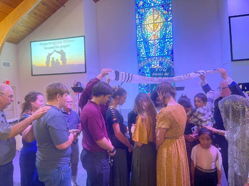 Prayer over the children at L'Chaim Messianic Congregation Lake Worth